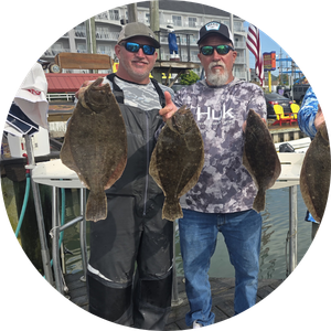 Two Anglers holding their flounder caught in Ocean City MD