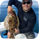 Angler flounder fishing on boat in calm offshore waters showing off what he caught during Ocean City Maryland fishing charter