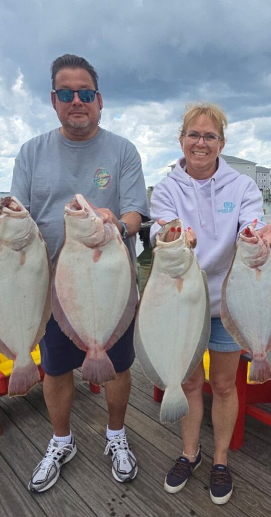 Anglers with flounder catch from Ocean City nearshore fishing charter at Bahia Marina